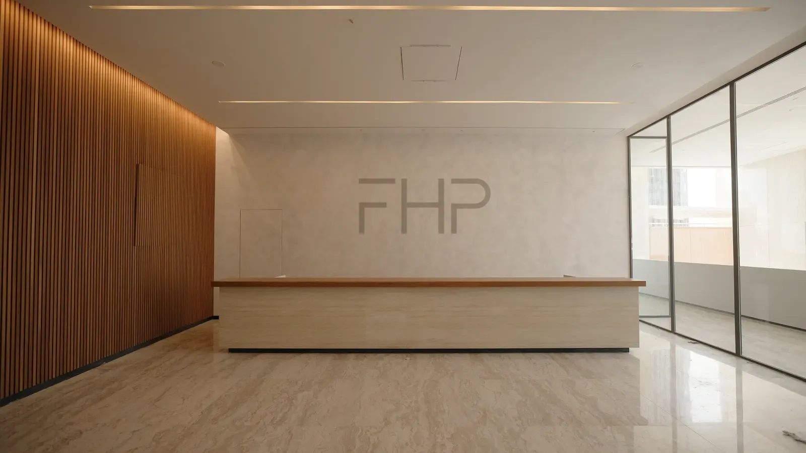 A handed-over office reception: oak slatted wall, travertine floor, stone desk, the FHP mark set into the plaster